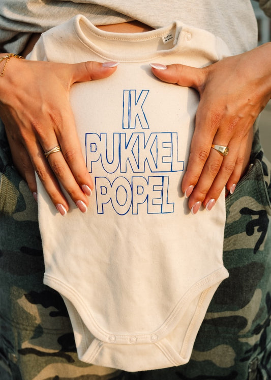 F24. Pukkelpopel baby body